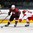 GRAND FORKS, NORTH DAKOTA - APRIL 24: Latvia's Roberts Kalkis #27 and Denmark's Christian Mathiasen #17 battle for the puck during relegation round action at the 2016 IIHF Ice Hockey U18 World Championship. (Photo by Matt Zambonin/HHOF-IIHF Images)

